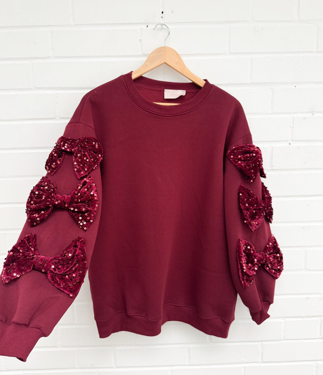 SWEATSHIRT MIT PAILLETTEN SCHLEIFEN - versch. Farben